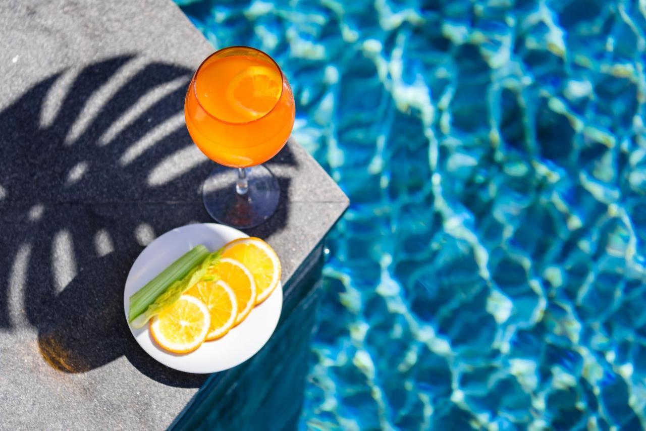 Oceanfront Beach Resort - Sha Extra Plus Patong Exterior foto A glass of Aperol Spritz